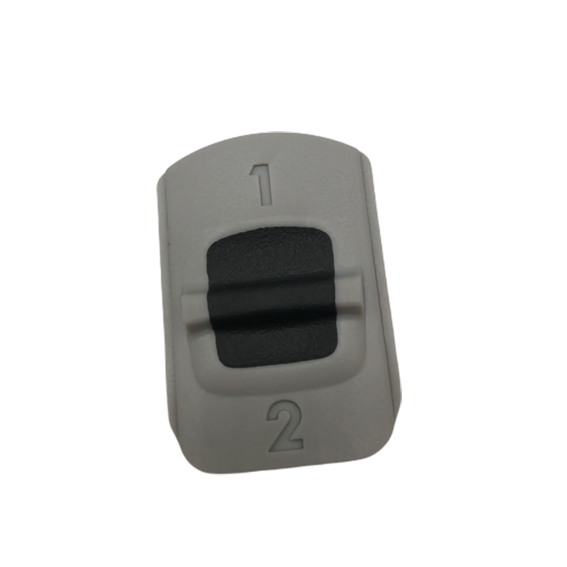 Two-color buttons with plastic overmold
